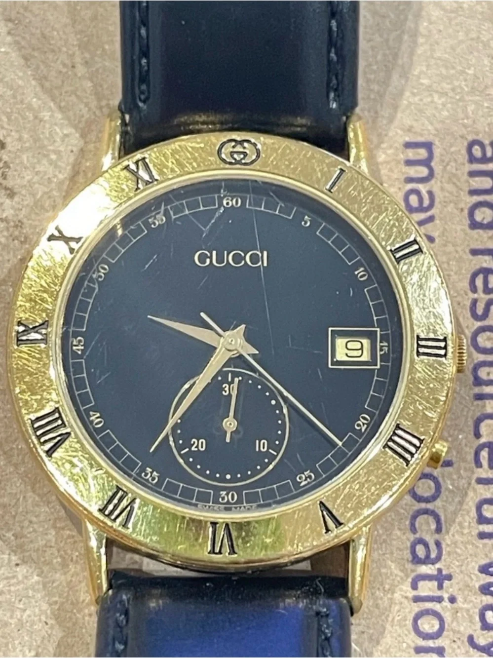 Gucci Black Dial Gold Bezel Leather Strap Watch